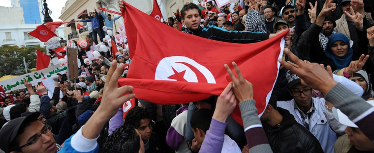 Image: Tunisians turn out to demand jobs and dignity as the country marks a year to the day since its despotic ruler fled