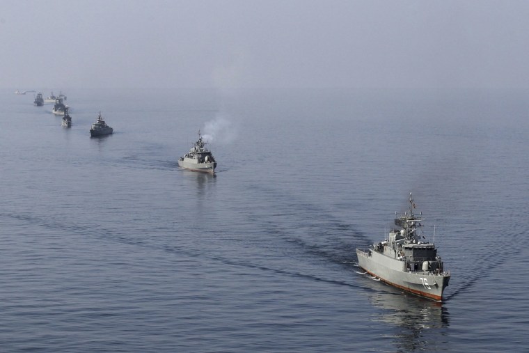 Image: Ships participate in naval parade on last day of Velayat-90 war game on Sea of Oman near Strait of Hormuz
