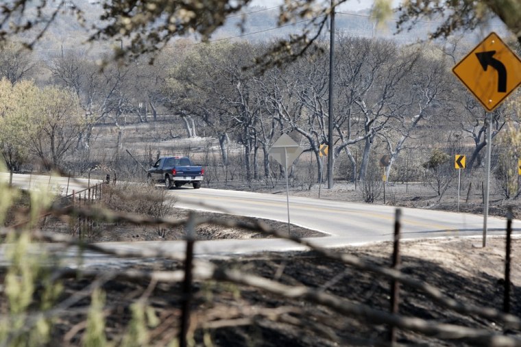 Image: A Paleface Ranch resident returns to the community after wildfires scorched most of the land and burned dozens of homes in Spicewood, Texas