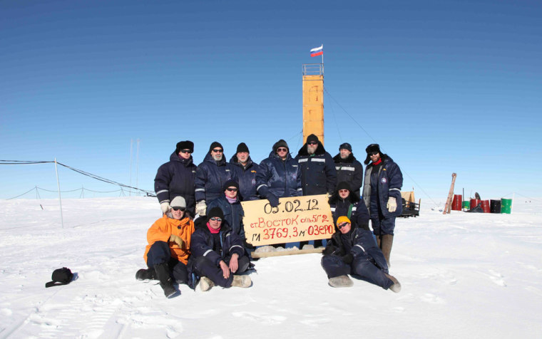 Image: Russian researchers at the Vostok station in Antarctica pose for a picture after reaching subglacial lake Vostok.