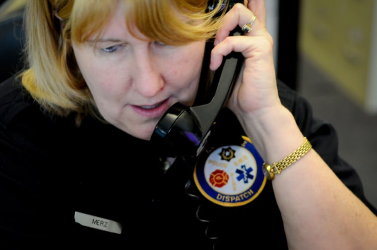Image: Lisa Merz answers a call at the 911 call center in Grapevine, Texas.