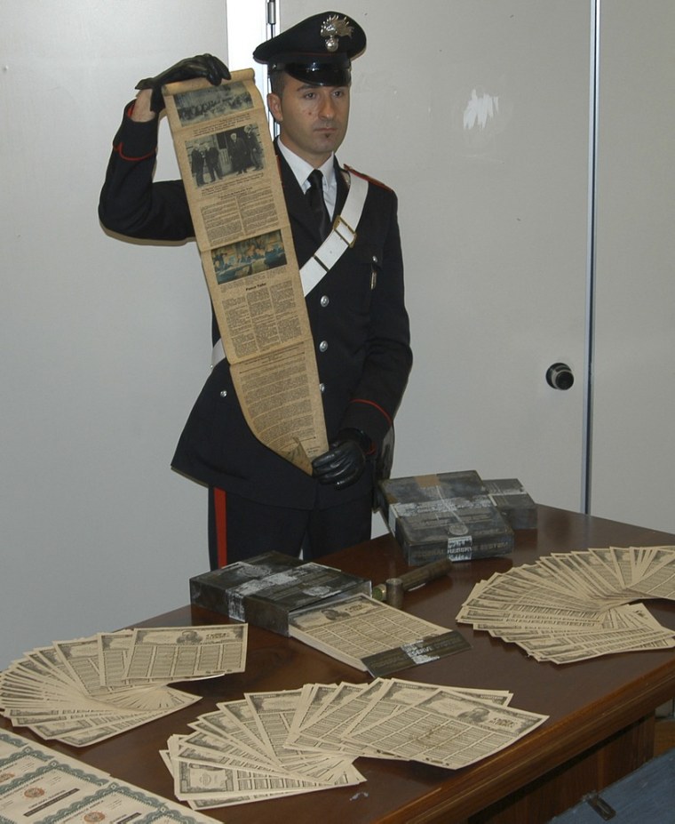 Image: Italian Carabinieri display fake U.S. Treasury bonds during a news conference in the southern Italian city of Potenza