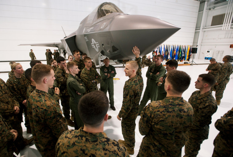 Image: Major Mike Rountree, a marine fighter attack training officer, shows naval flight students a U.S. Marine F-35B Joint Strike Fighter Jet during a roll-out ceremony at Eglin Air Force Base in Florida