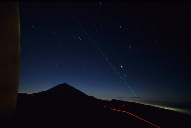 Image: A laser beam is transmitted from La Palma