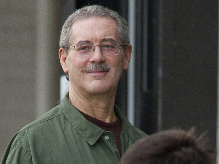 Image: Allen Stanford smiles as he waits to enter the Federal Courthouse where the jury is deliberating in his criminal trial in Houston