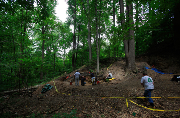 Researchers work at the site believed to be a mass grave for immigrant Irish railroad workers in Malvern, Pa.