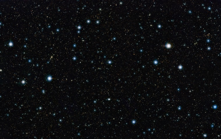 This view shows a section of the widest deep view of the sky ever taken using infrared light, with a total effective exposure time of 55 hours. It was created by combining more than 6,000 individual images from the VISTA survey telescope at ESO’s Paranal Observatory in Chile. This picture shows a region of the sky known as the COSMOS field in the constellation of Sextans (The Sextant). More than 200,000 galaxies have been identified in this picture.