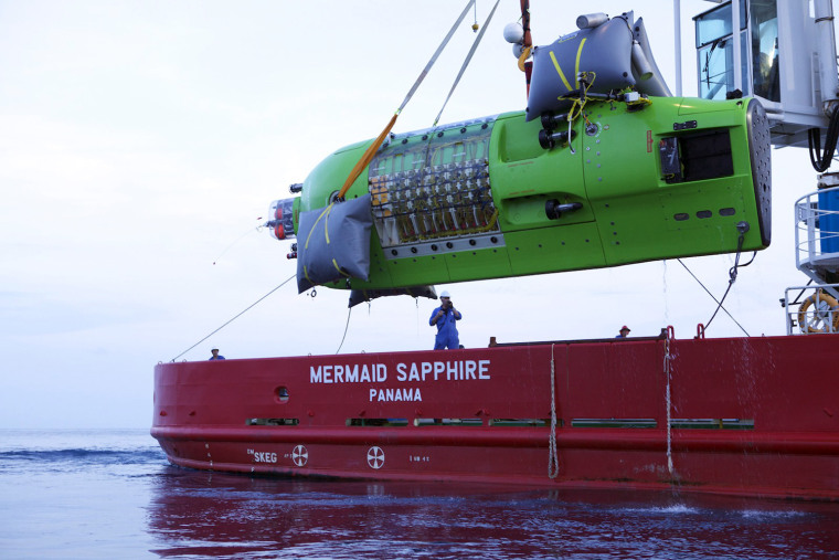 Image: Handout photo of the Deepsea Challenger being lowered into the water for testing off the coast of Australia