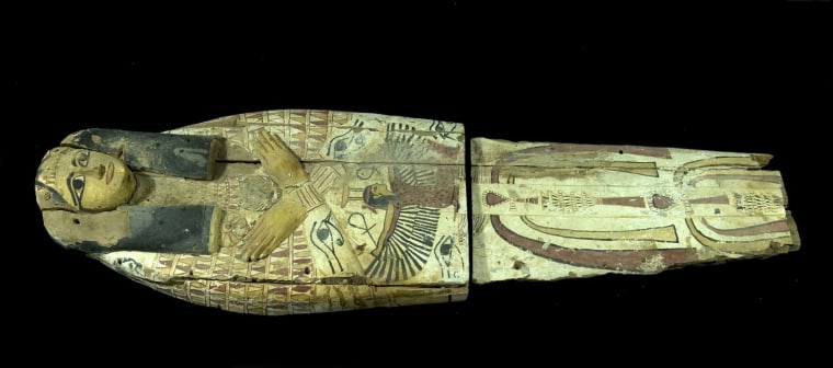 The wooden cover, which would have held a mummy in the past, had been cut in half, likely by smugglers who needed to fit the artifacts into a suitcase.