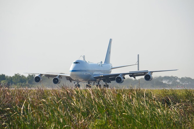 NASA's modified Boeing 747 Shuttle Carrier Aircraft lands at the Kennedy Space Center in Florida Tuesday.