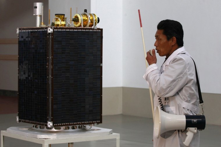 Image: Scientist introduces Kwangmyongsong-3 application satellite
