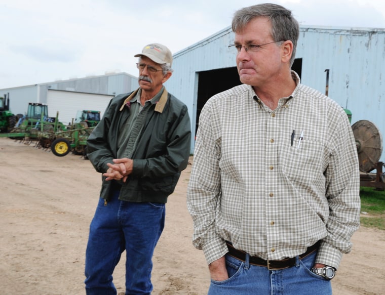 Image: Billy Hefner, left, and Ron Gertson talk on Gertson's farm in Lissie, Texas