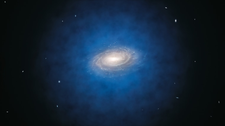 This artist’s impression shows the Milky Way galaxy. The blue halo of material surrounding the galaxy indicates the expected distribution of the mysterious dark matter, which was first introduced by astronomers to explain the rotation properties of the galaxy and is now also an essential ingredient in current theories of the formation and evolution of galaxies.