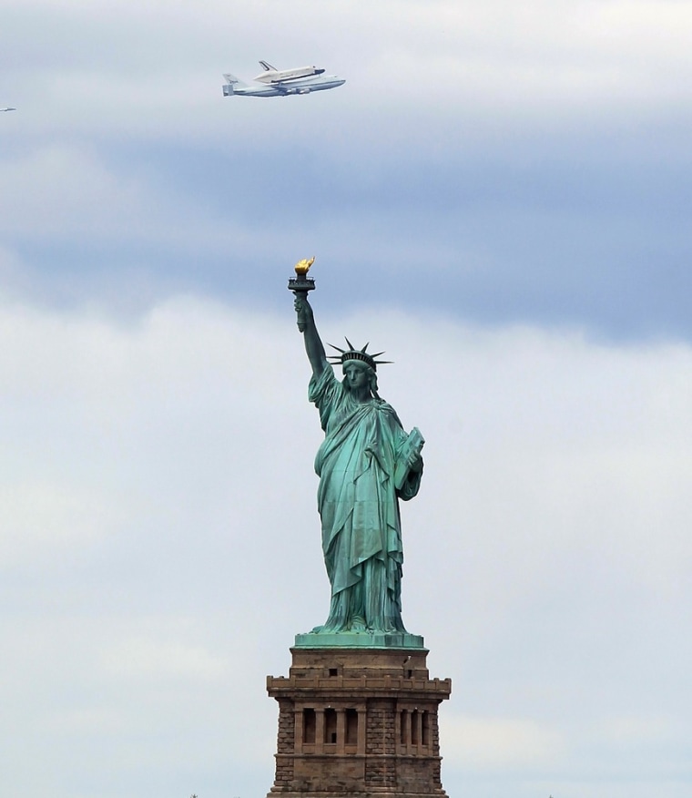 Image: Space Shuttle Enterprise flies over the Statue of Liberty in New York City