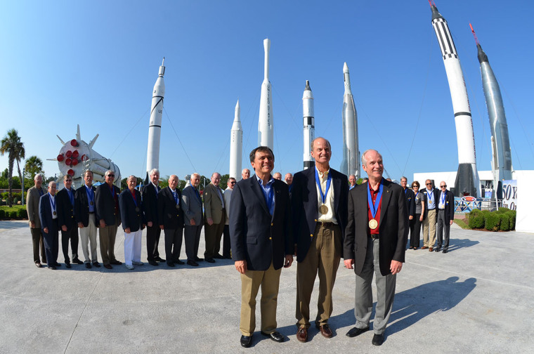 Franklin Chang Diaz, Kevin Chilton and Charles Precourt stand before their fellow U.S. Astronaut Hall of Fame inductees.