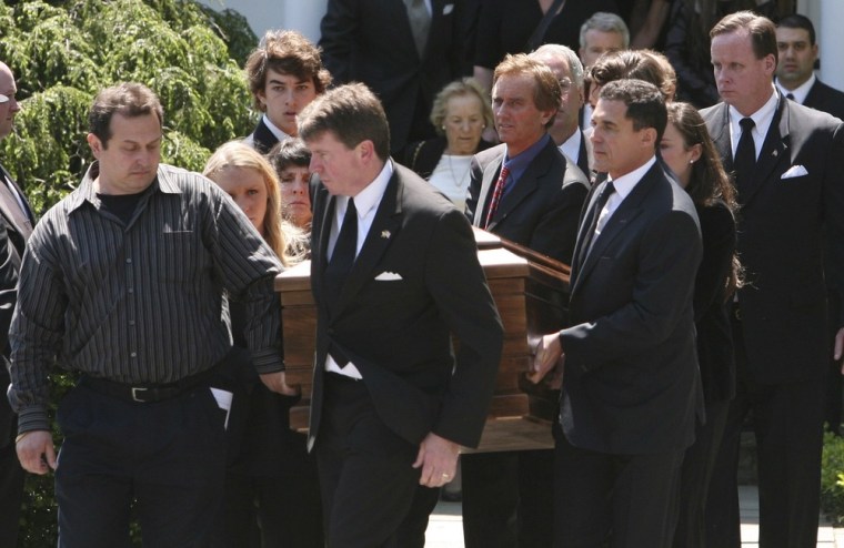 Image: Mary Kennedy's casket is carried out of St. Patrick's Church by family after her funeral service concluded in Bedford