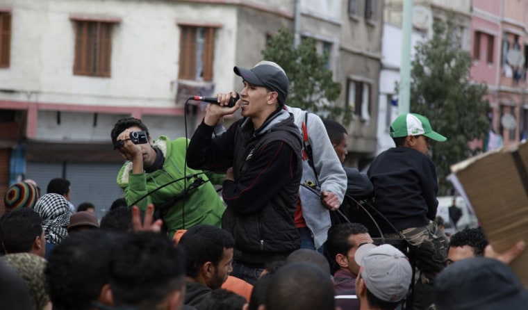 Image: Moroccan rapper Belrhouat performs during a demonstration in Casablanca