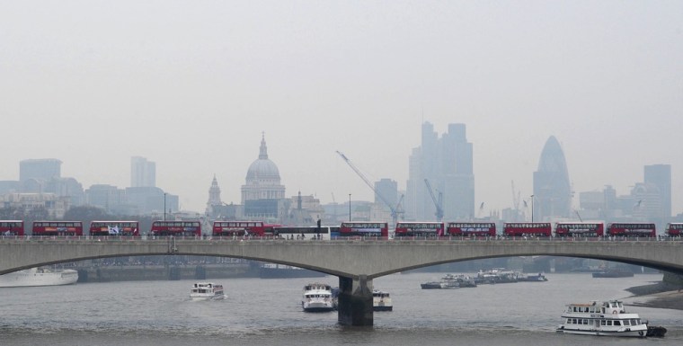 Image: London buses queue along Waterloo Bridge as protesters march along the Embankment in central London.