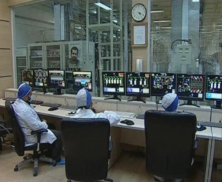 Image: Still image taken from video shows workers in what is described by Iranian state television as an enrichment control room at a facility in Natanz