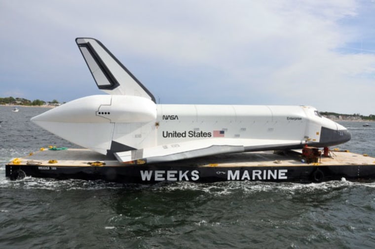 The space shuttle Enterprise, a NASA prototype, suffered minor wingtip damage when it grazed a bridge support while riding a barge from JFK airport in New York City to a temporary port in New Jersey on Sunday. Enterprise is headed for NYC's Intrepid Sea, Air & Space Museum.