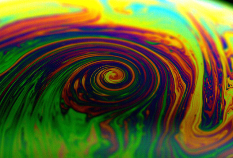 This vortex was created in a soap bubble. Scientists note that hurricanes have similar vortexes.