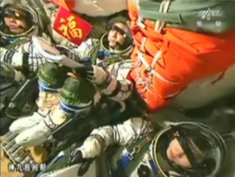 Image: Chinese astronauts in capsule