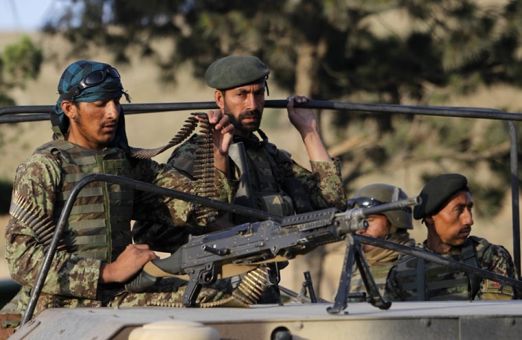 Image: Afghan National Army soldiers arrive at the site of an attack on the outskirts of Kabul