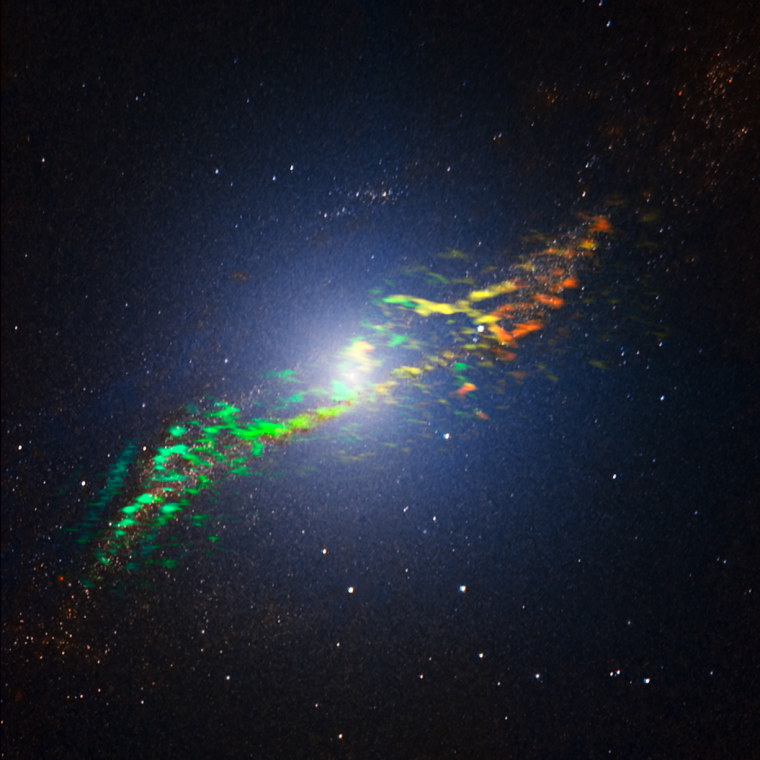This new image of Centaurus A, released on May 31, combines ALMA and near-infrared observations of the massive elliptical radio galaxy. The ALMA observations, shown in a range of green, yellow and orange colors, reveal the position and motion of the clouds of gas in the galaxy.