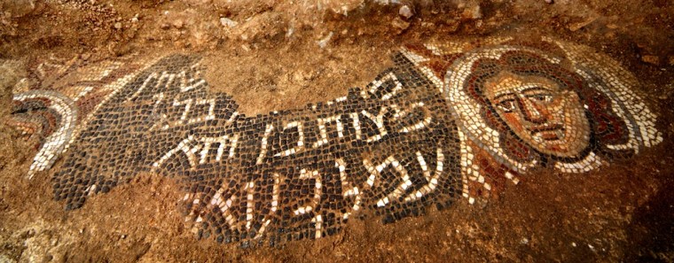 Huqoq mosaic with female face and inscription.  Photo by Jim Haberman.