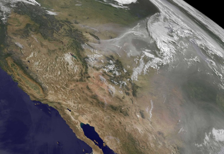 In a June 28 satellite image, smoke from wildfires hangs over North America.
