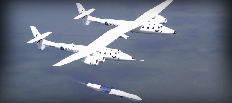 A concept illustration shows Virgin Galactic's LauncherOne rocket deploying beneath the WhiteKnightTwo mothership. This image was released Tuesday.