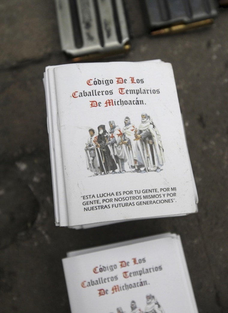 Image: File photo of a booklet is seen during the presentation of suspects to the media in Morelia