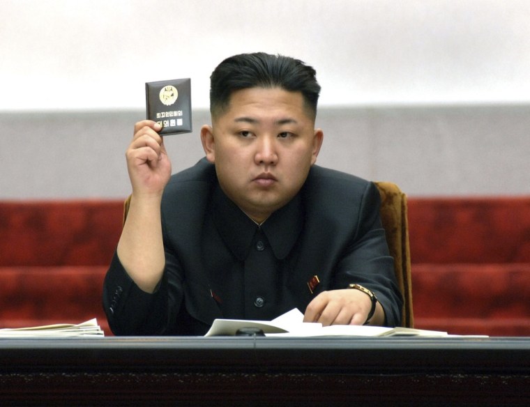 Image: North Korean leader Kim Jong-Un holds up his ballot during the fifth session of the 12th Supreme People's Assembly.