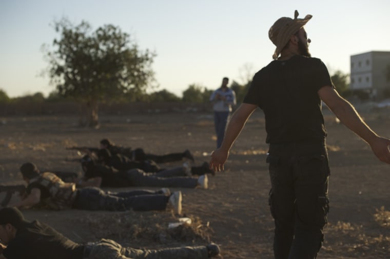 Image: Syrian rebel fighters shoot during targe