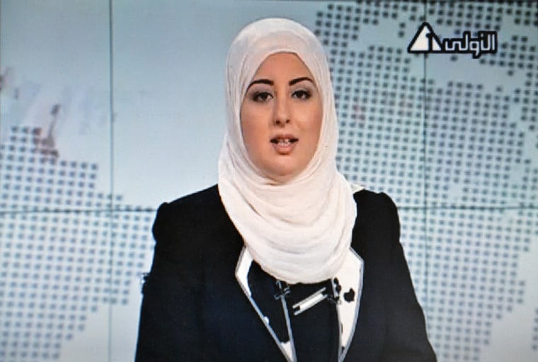 Image: An image grab taken from Egyptian state TV shows Egyptian anchorwoman Fatma Nabil wearing an Islamic headscarf