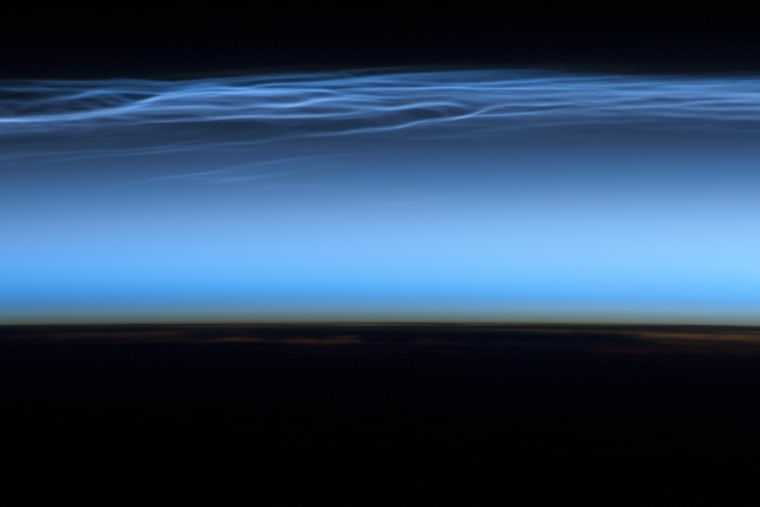 Astronauts on the International Space Station took this picture of noctilucent clouds near the top of Earth's atmosphere on July 13.