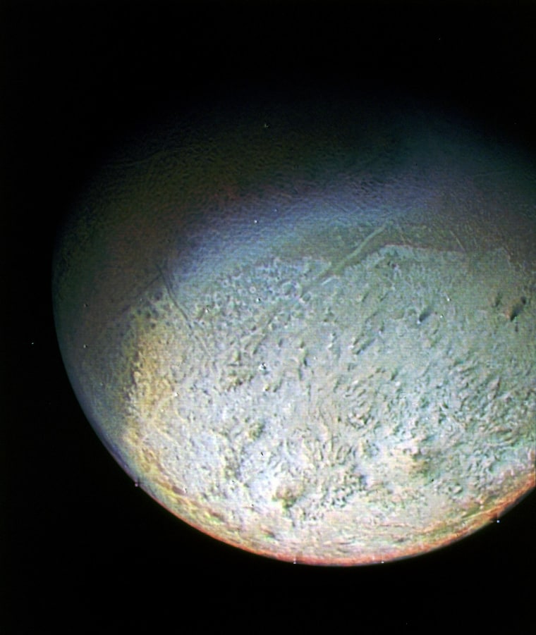 This color photo of Neptune's largest moon Triton was obtained by NASA's Voyager 2 probe on Aug. 24, 1989, from 330,000 miles away. The resolution is about 6.2 miles, sufficient to begin to show topographic detail.