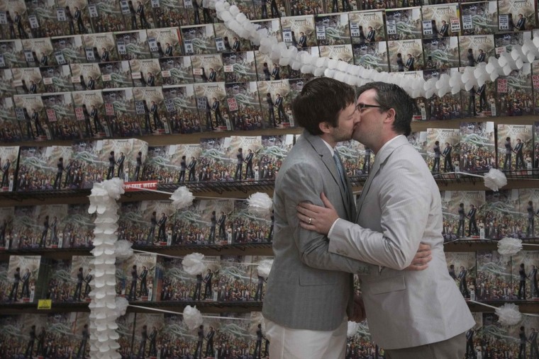 Image: Welker and Everhart kiss after exchanging vows during their wedding ceremony at a comic book retail shop in Manhattan, New York
