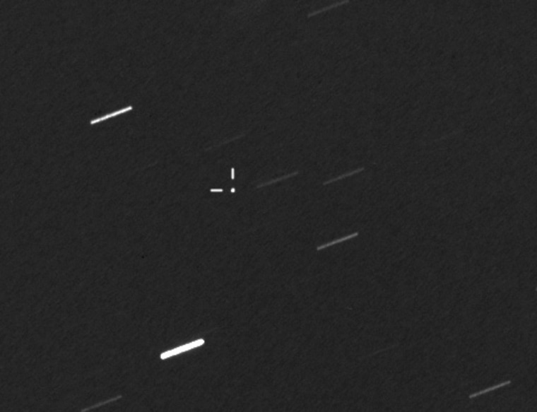 This image shows the asteroid 2012 QG42 in the crosshairs on Sept. 6, as seen using the Planewave 17-inch telescope, part of the Virtual Telescope Project. The telescope was tracking the fast apparent motion of the asteroid against the background of distant stars, which show up as streaks in this image.