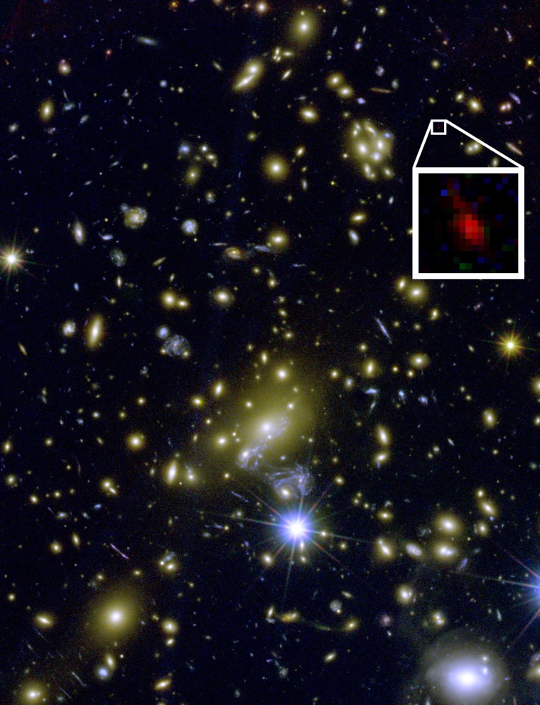 This composite color image shows the galaxy cluster MACS1149+2223, which creates a gravitational lens to magnify an extremely distant galaxy in the background (inset). The galaxy may have helped lift the fog of the early universe, scientists say.