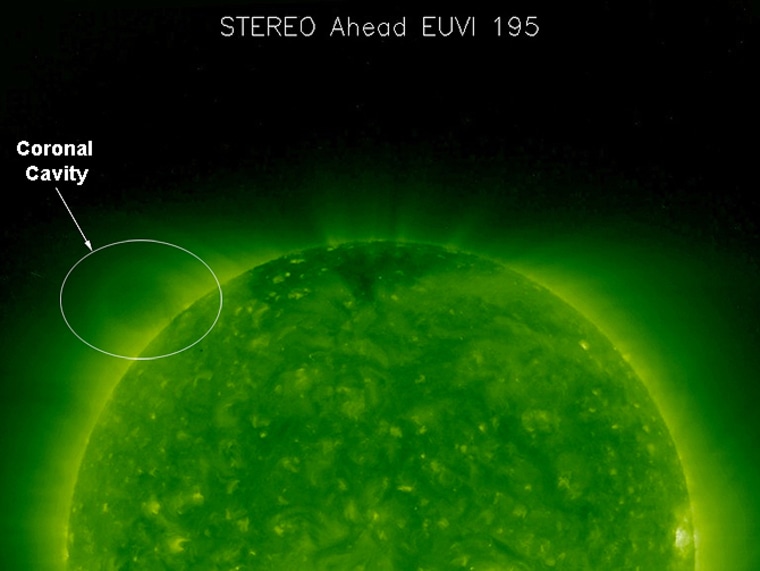 The faint oval above the upper left limb of the sun in this picture is known as a coronal cavity. One of NASA’s twin Solar and Terrestrial Relations Observatory (STEREO) spacecraft captured this image on Aug. 9, 2007. 
