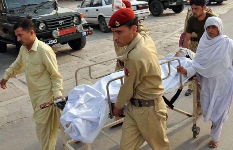 Image: Soldiers carry Malala Yousafzai, 14, at an army hospital following an attack by gunmen in Peshawar, Pakistan, on Oct. 9, 2012.