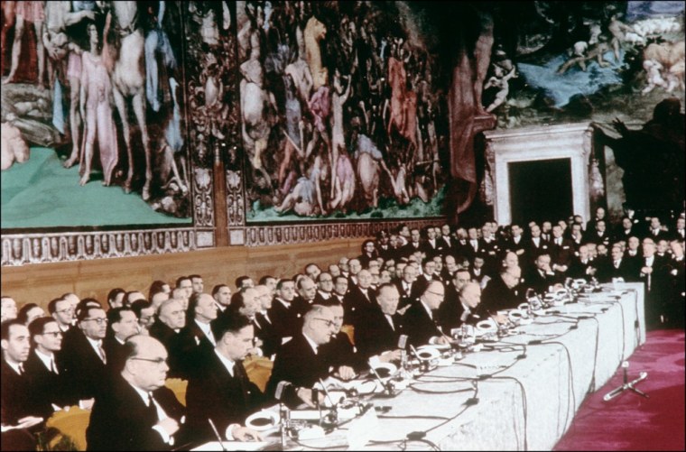 Image: A picture taken on March 25, 1957 in Rome shows foreign affairs ministers signing the treaties creating the European Economic community (EEC) and the Euratom.