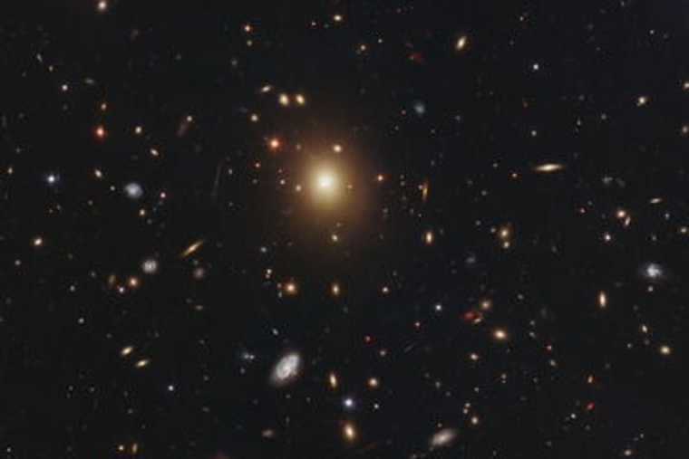 The giant elliptical galaxy in the center of this image, taken by NASA's Hubble Space Telescope is the most massive and brightest member of the galaxy cluster Abell 2261. 