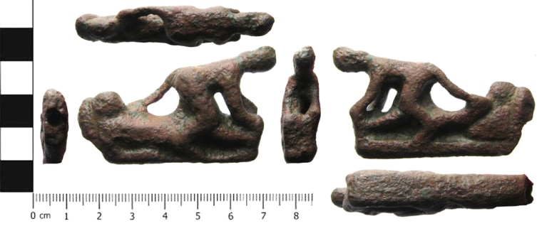 This copper alloy knife handle shows a couple having sex. The man is lying on a couch while the woman straddles him, holding his feet. The man's left hand is on her left buttock. Researchers hypothesize that a knife handle like this might be used to ward off the evil eye. Photo by A. Downes, Â© West Yorkshire Archaeology Advisory Service. CC Attribution Sharealike license