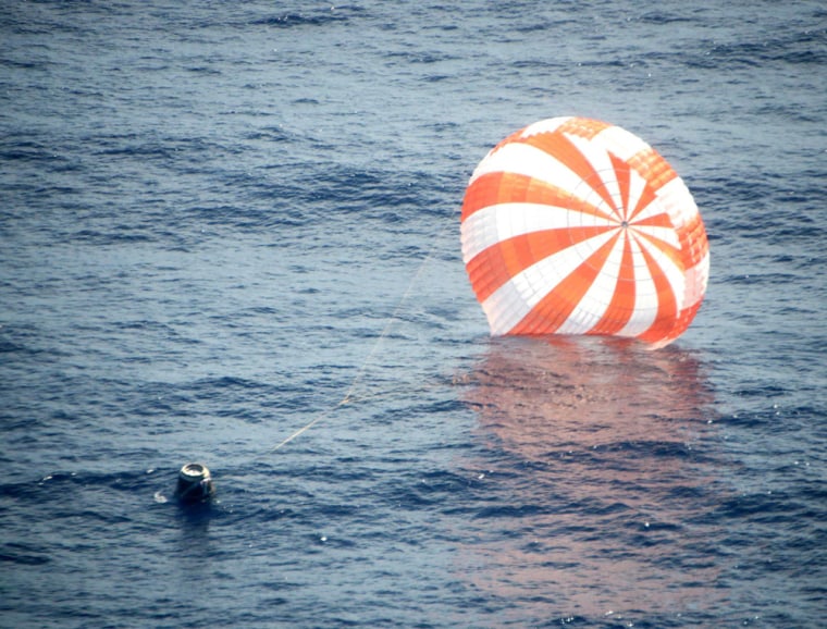 Image: SpaceX's Dragon capsule is pictured after splashing down approximately 250 miles off the coast of southern California