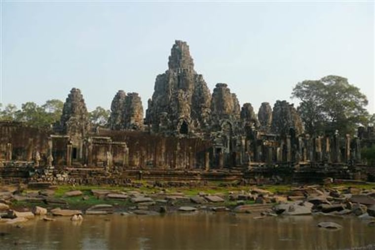 Bayon temple, constructed by Angkorian King Jayavarman VII in the late 12th century.  The complex was built to honor the Hindu god Vishnu, but 14th-century leaders converted the site into a Buddhist temple.