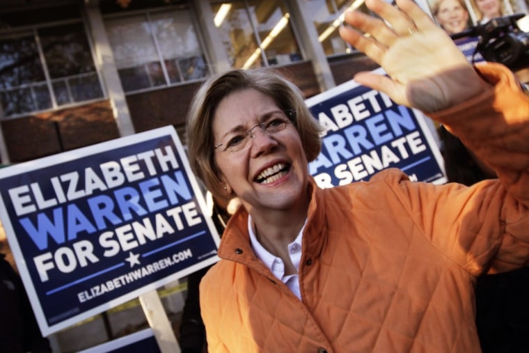 Image: Warren waves to supporters before voting during the U.S. presidential election in Cambridge
