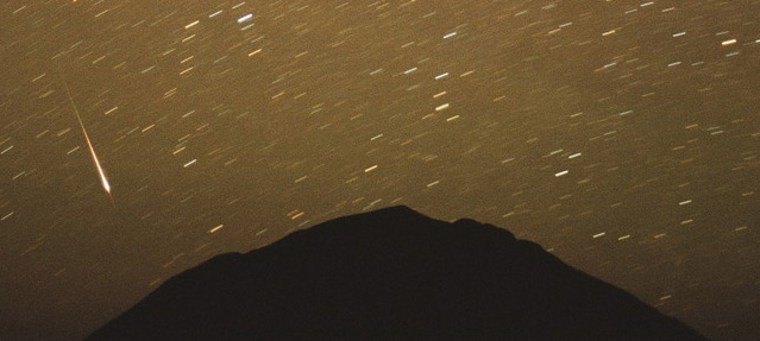 Photographer Chris Gruhusko captured this view of the Leonid meteor shower in November 2001 over the north face of Wind Mountain in the Cornudas Mountains of Southern New Mexico.