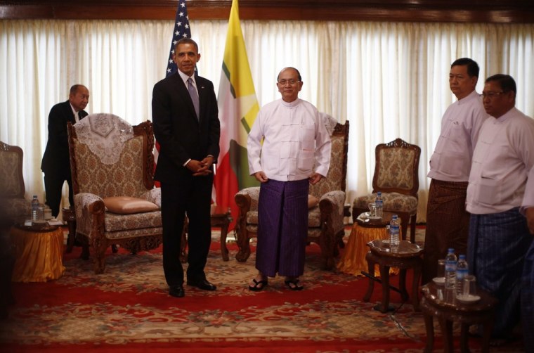 Image: U.S. President Barack Obama stands next to Myanmar's President Thein Sein during their meeting in Yangon